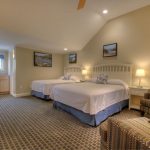Queen and double beds with vaulted ceiling.