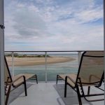 Beach view from sliding glass door.