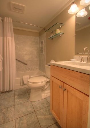 Private bathroom with shower and tub.