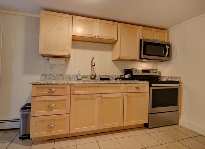 Full kitchen furnished with appliances.