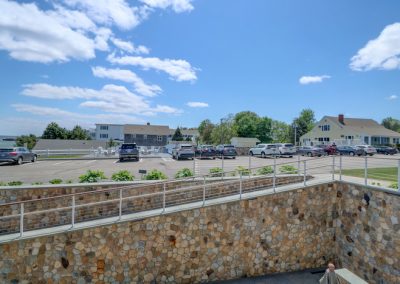 Directly across the lot from outdoor amenities.