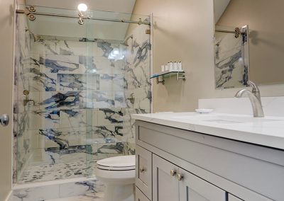Bathroom with large double-head shower, no tub.