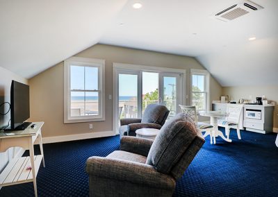 Recliners, dining area and path to balcony. Curtains will be added.