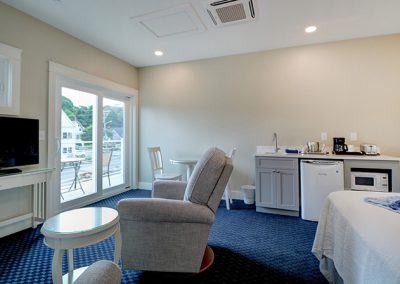 Seating area, street-view balcony and wet bar.