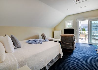 King bed room with large balcony overlooking Shore Road.