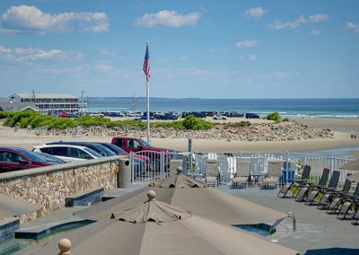 View from the entrance of Room 75, showing the pool, tidal river and beach.
