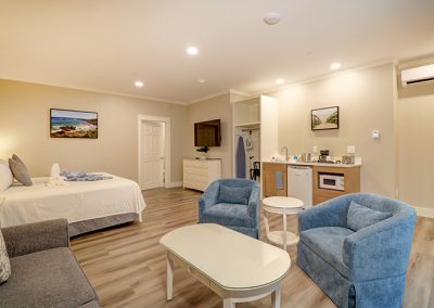 Room 75 view from interior corner, showing seating area and other amenities.